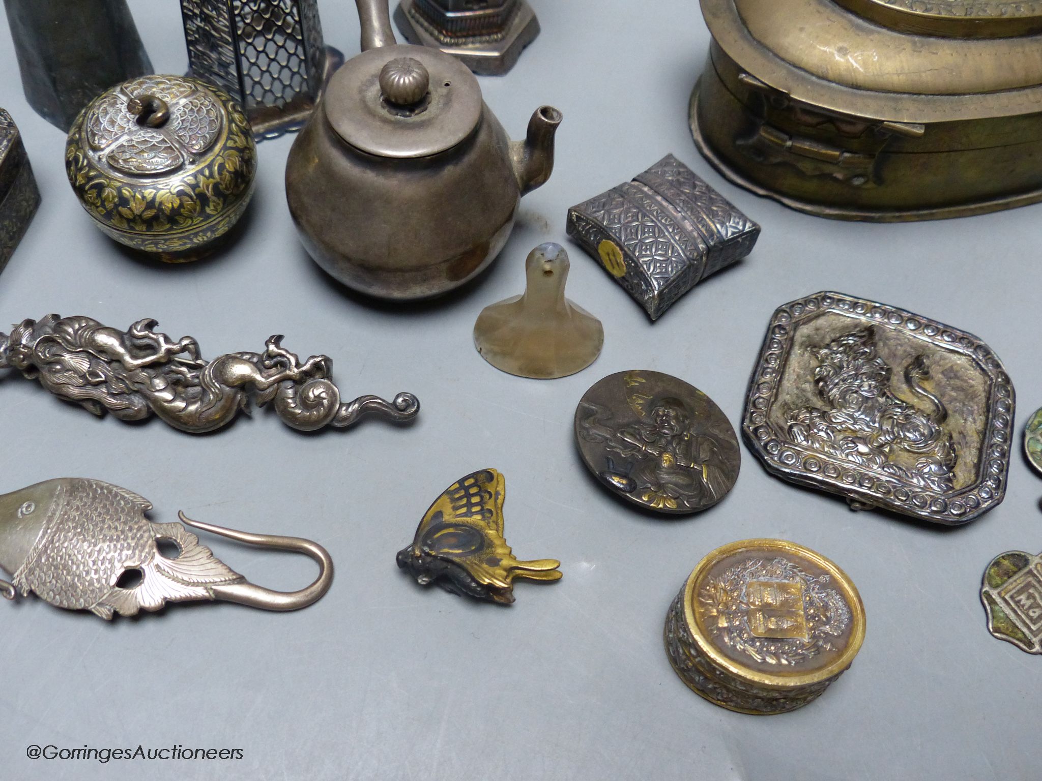 A group of Asian and other small collectables, white metal, brass, jade etc.
